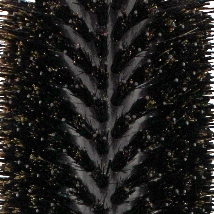 Close-up of the V-shaped natural boar and double ionic nylon bristle arrangement